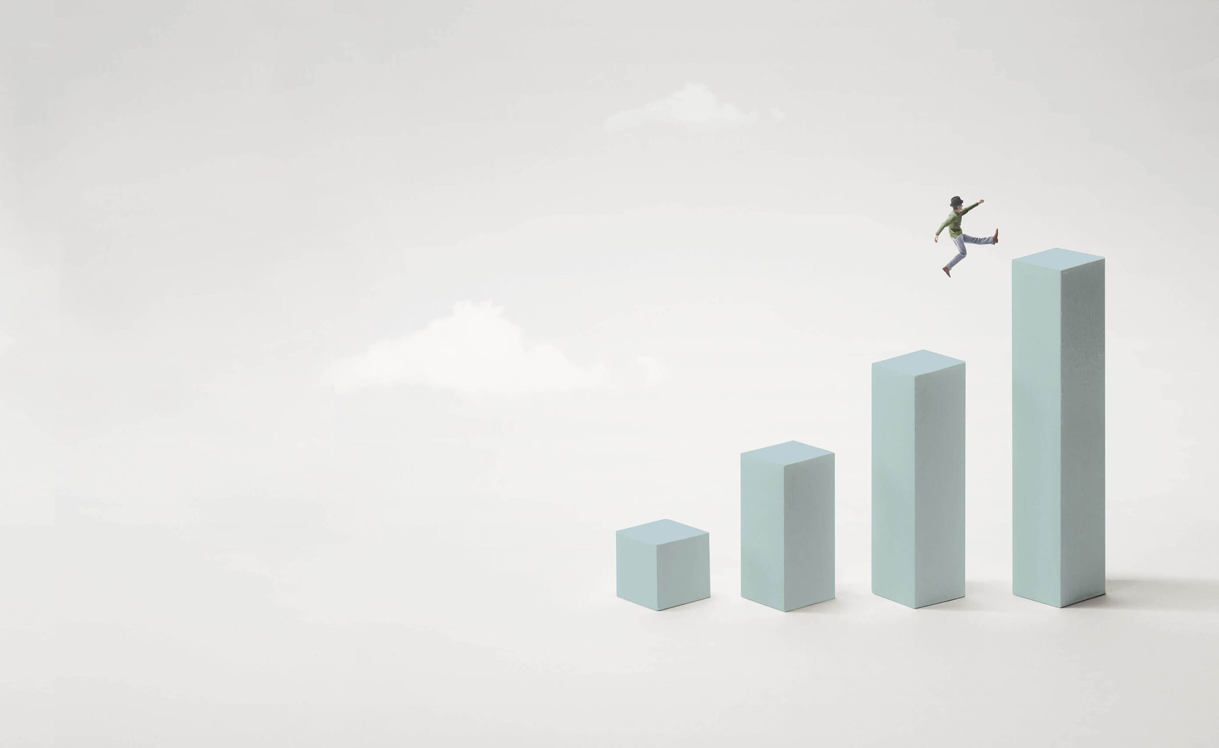 A figure leaping up ascending bar-chart columns toward greater heights