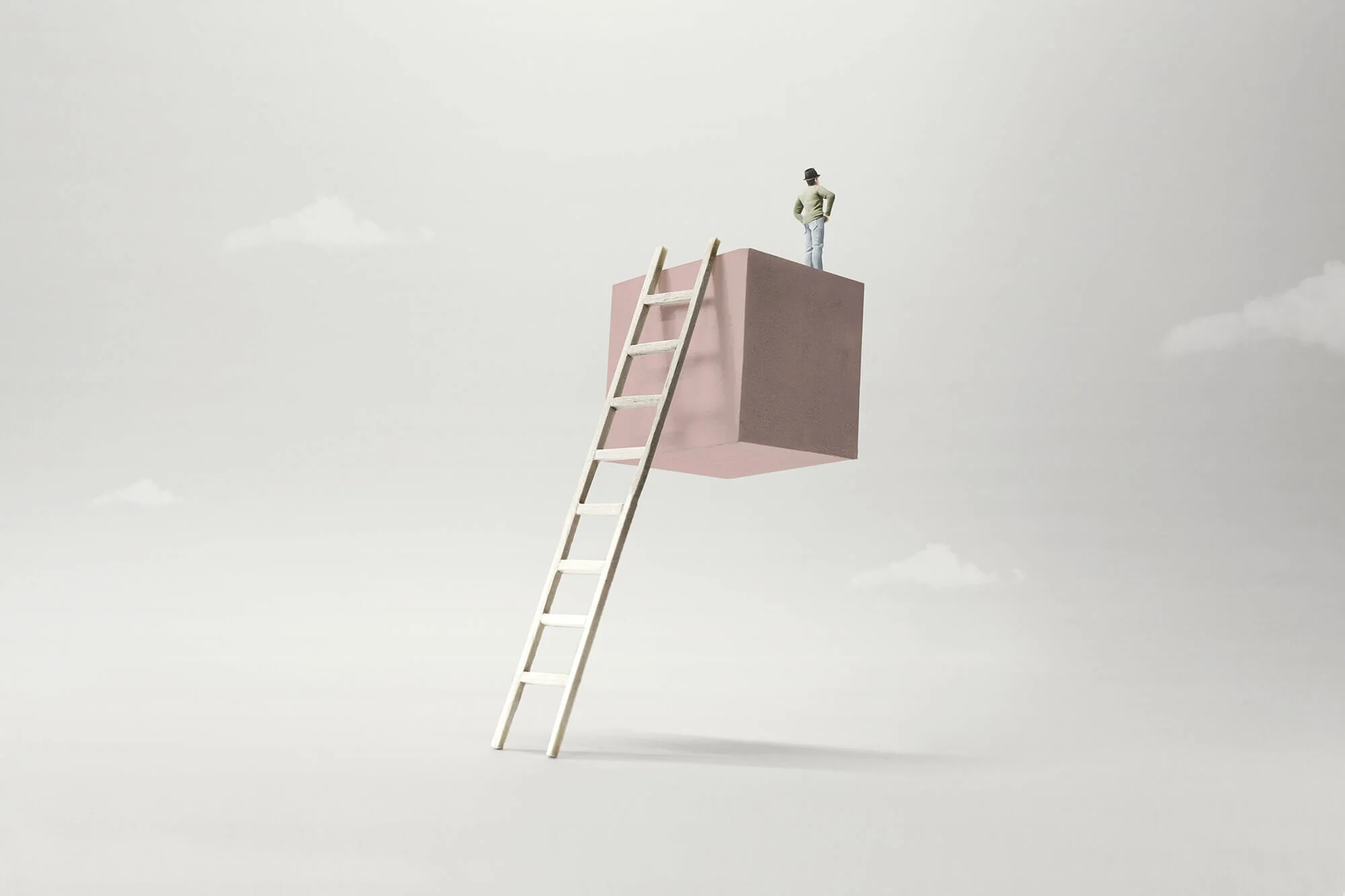 A tiny figure standing atop a floating cube reached by a ladder, symbolizing ambitious growth